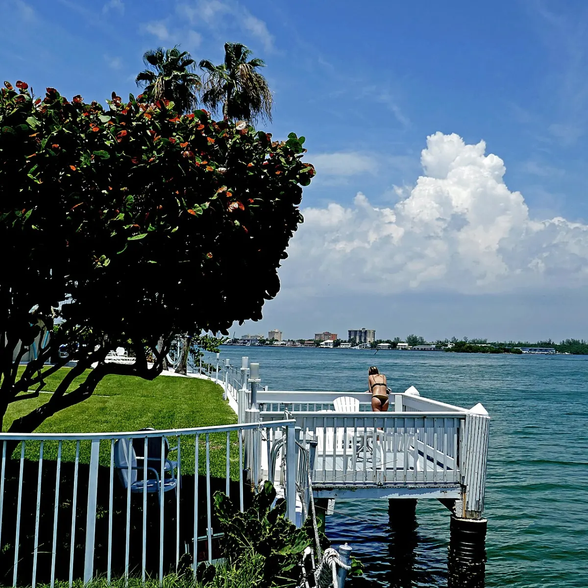 A seawall, dock and railing at the bay edge of Bay Harbor Islands