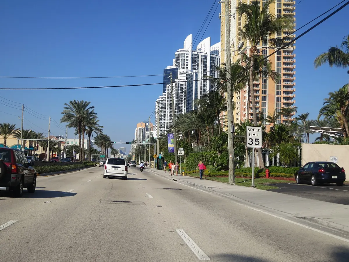 Collins Avenue in Sunny Isles Beach with oceanfront high-rise towers along the road